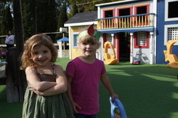 Two girls posing outside while playing